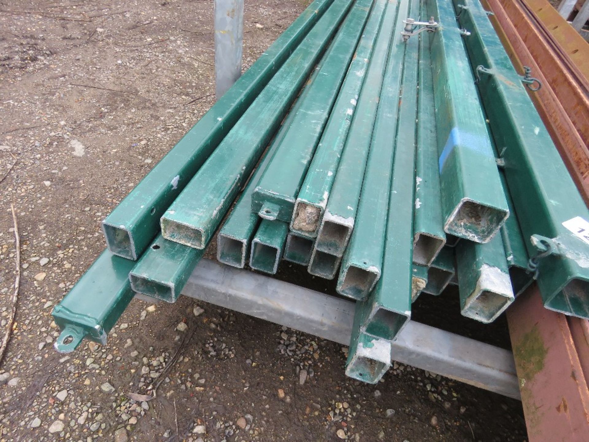 QUANTITY OF GREEN FENCE POSTS, 10FT LENGTH APPROX. THIS LOT IS SOLD UNDER THE AUCTIONEERS MARGIN SCH