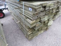 LARGE PACK OF PRESSURE TREATED FEATHER EDGE CLADDING BOARDS. 1.8M LENGTH X 10CM WIDTH APPROX.