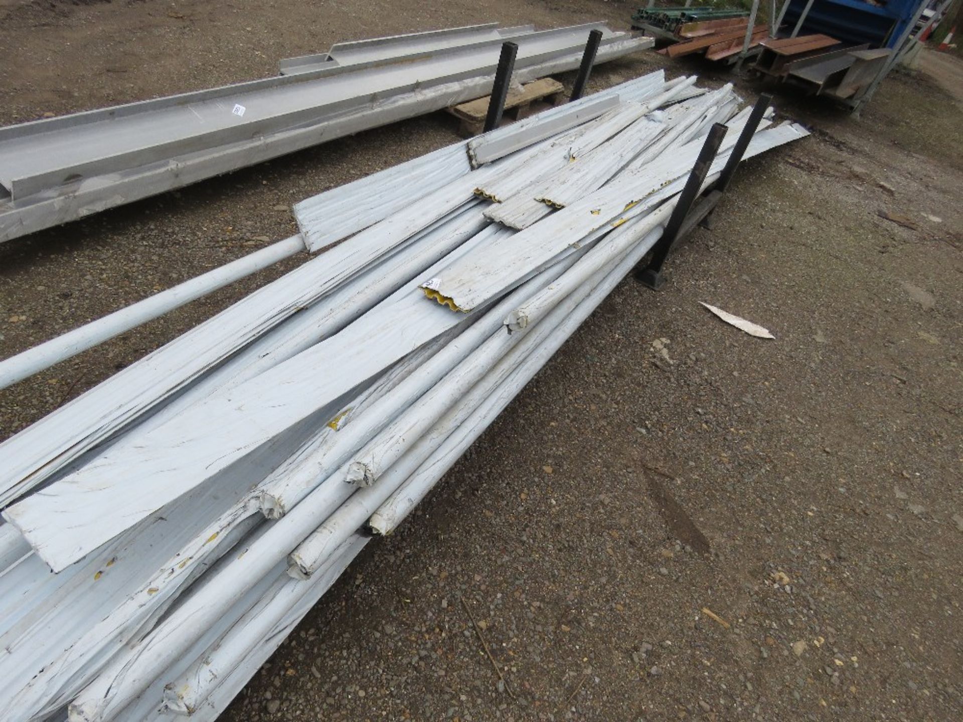 STILLAGE CONTAINING ASSORTED YELLOW PLASTIC CLADDING, 4FT - 20FT LENGTH APPROX. THIS LOT IS SOLD UND - Image 3 of 4