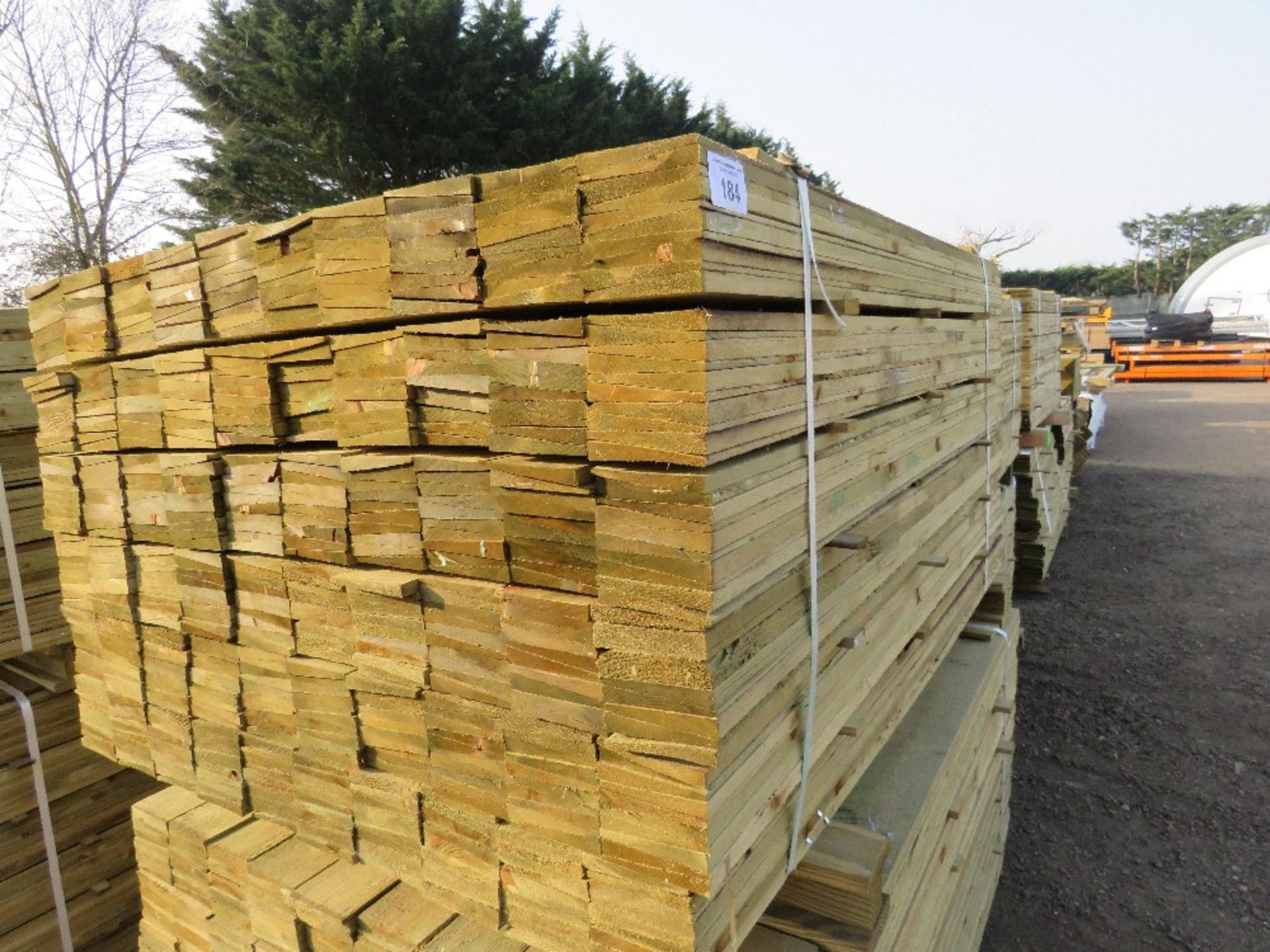 LARGE PACK OF PRESSURE TREATED FEATHER EDGE FENCE CLADDING BOARDS. 1.5M LENGTH X 100MM WIDTH APPROX.