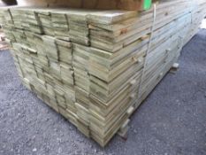 LARGE PACK OF PRESSURE TREATED FEATHER EDGE FENCE CLADDING BOARDS. 1.5M LENGTH X 100MM WIDTH APPROX.