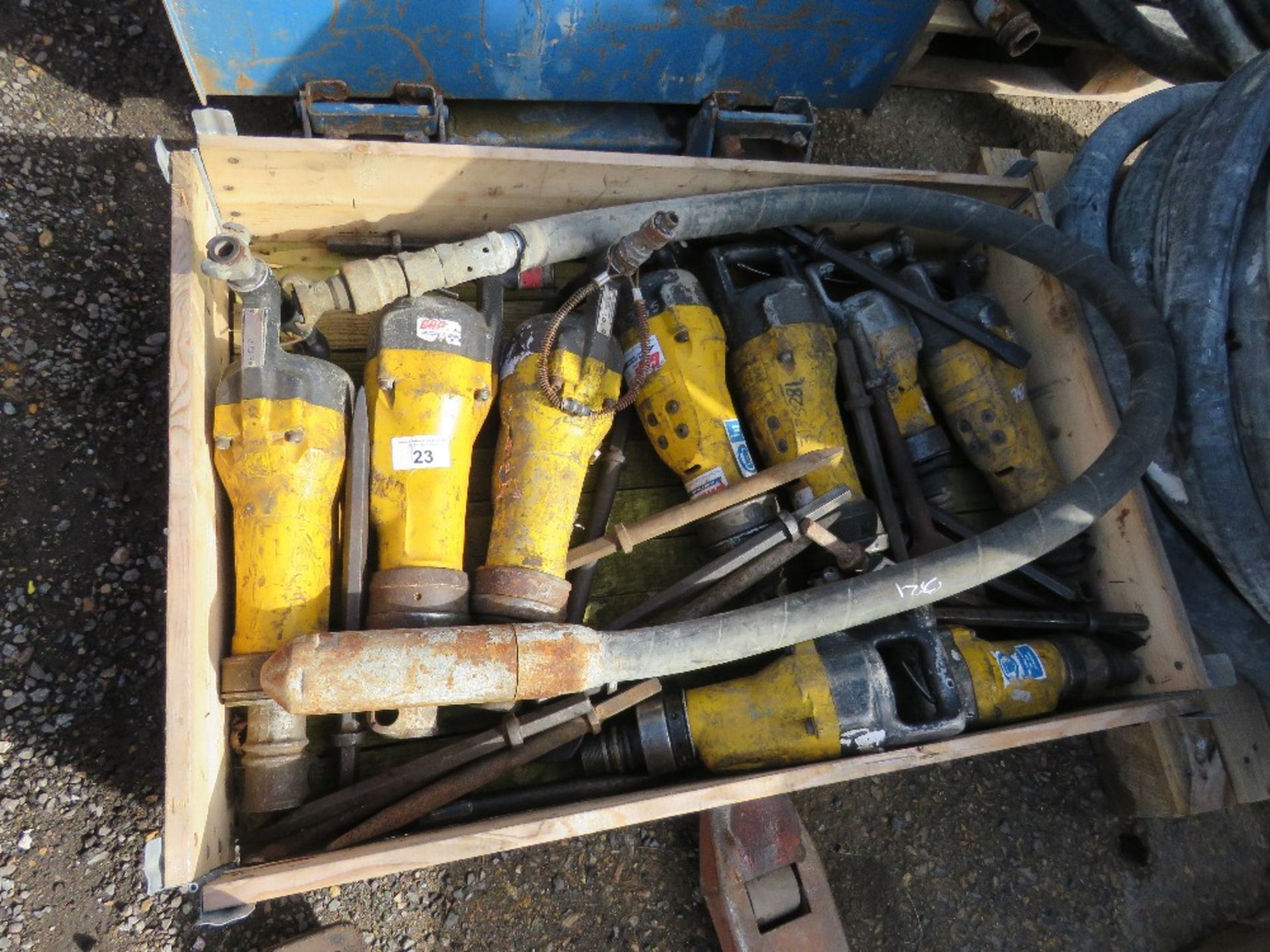 STILLAGE CONTAINING 9 X ATLAS COPCO DEMOLITION PLICKS PLUS POINST AND AN AIR POKER.