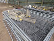 STACK OF APPROXIMATELY 25 X HERAS TYPE TEMPORARY SITE FENCE PANELS WITH SOME CLIPS AND FEET AS SHOWN