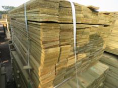LARGE PACK OF PRESSURE TREATED FEATHER EDGE FENCE CLADDING BOARDS. 1.35M LENGTH X 100MM WIDTH APPROX