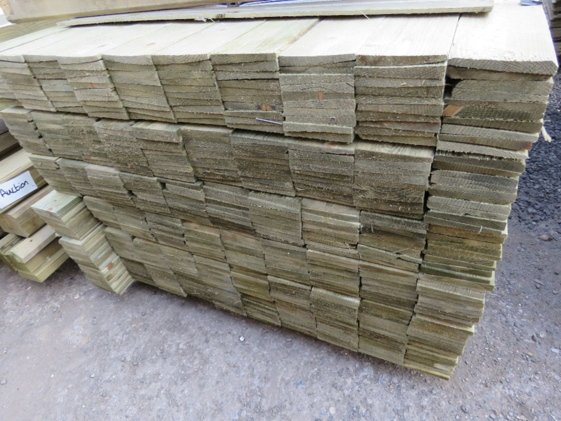 LARGE PACK OF PRESSURE TREATED FEATHER EDGE FENCE CLADDING BOARDS. 1.8M LENGTH X 100MM WIDTH APPROX. - Image 2 of 3