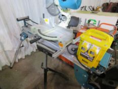 MAKITA LS1040 SAW TABLE ON LEGS, 110VOLT POWERED. WITH ROLLER STAND AND A TRANSFORMER. SOURCED FROM