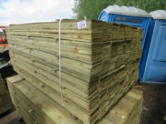 LARGE PACK OF FEATHER EDGE TREATED CLADDING BOARDS. 1.65M LENGTH X 10CM WIDTH APPROX