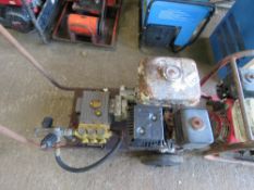 HONDA ENGINED PRESSURE WASHER PUMP ON WHEELS.