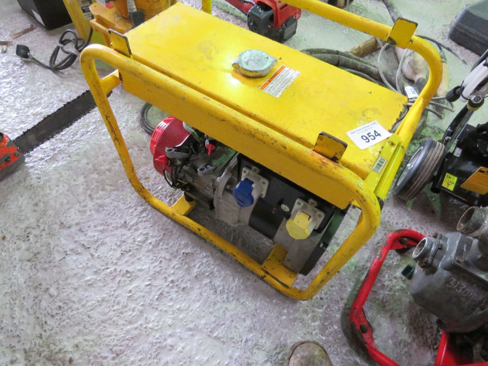 YELLOW HONDA ENGINED PETROL ENGINED GENERATOR.