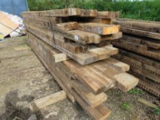 LARGE STACK OF HEAVY PRE USED MAINLY DENAILED TIMBERS, 11FT-15FT LENGTH APPROX, MAINLY 9" AND 11" SI