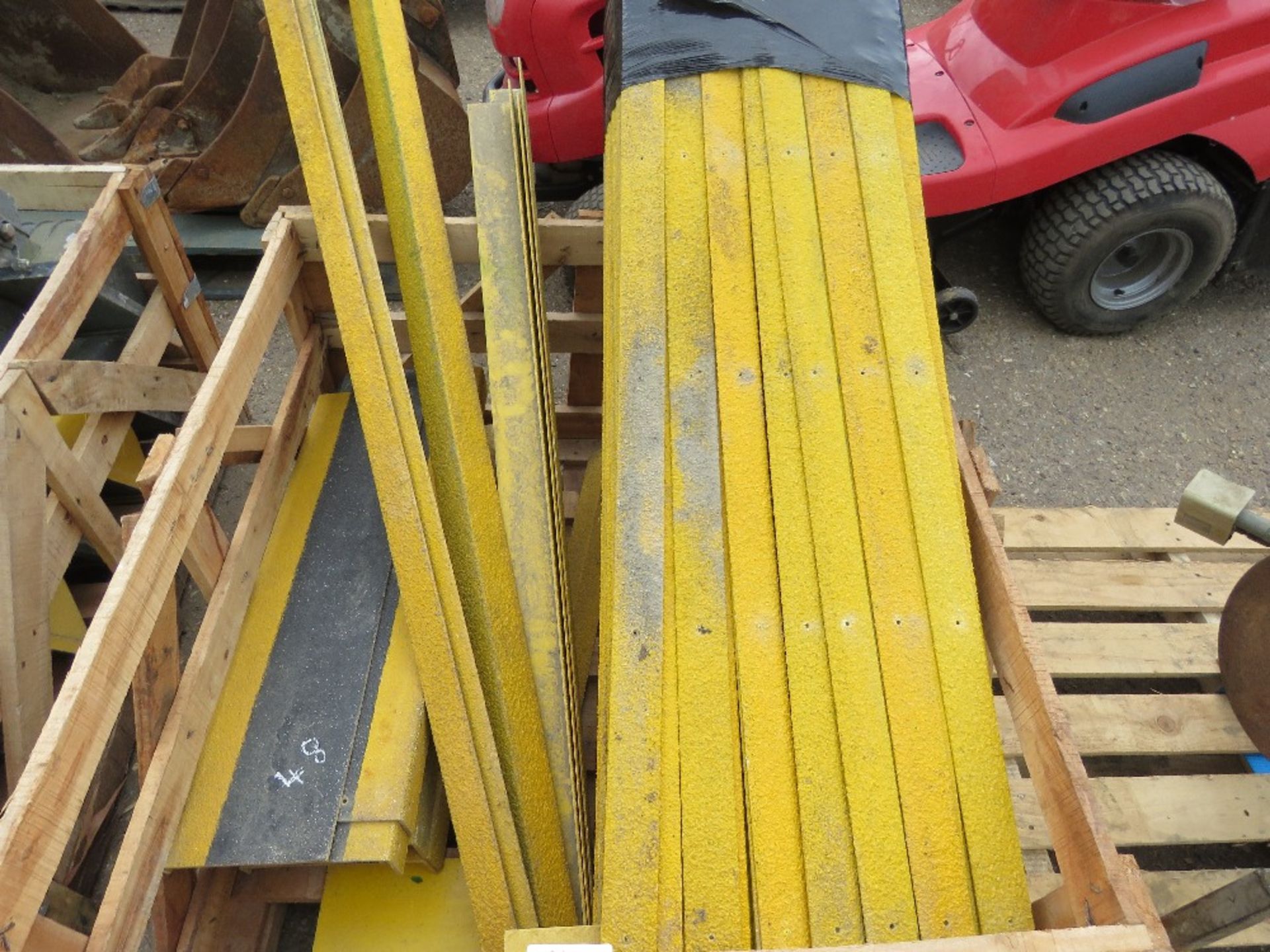 STILLAGE CONTAINING ANTI SLIP STAIR TREAD STRIPS.