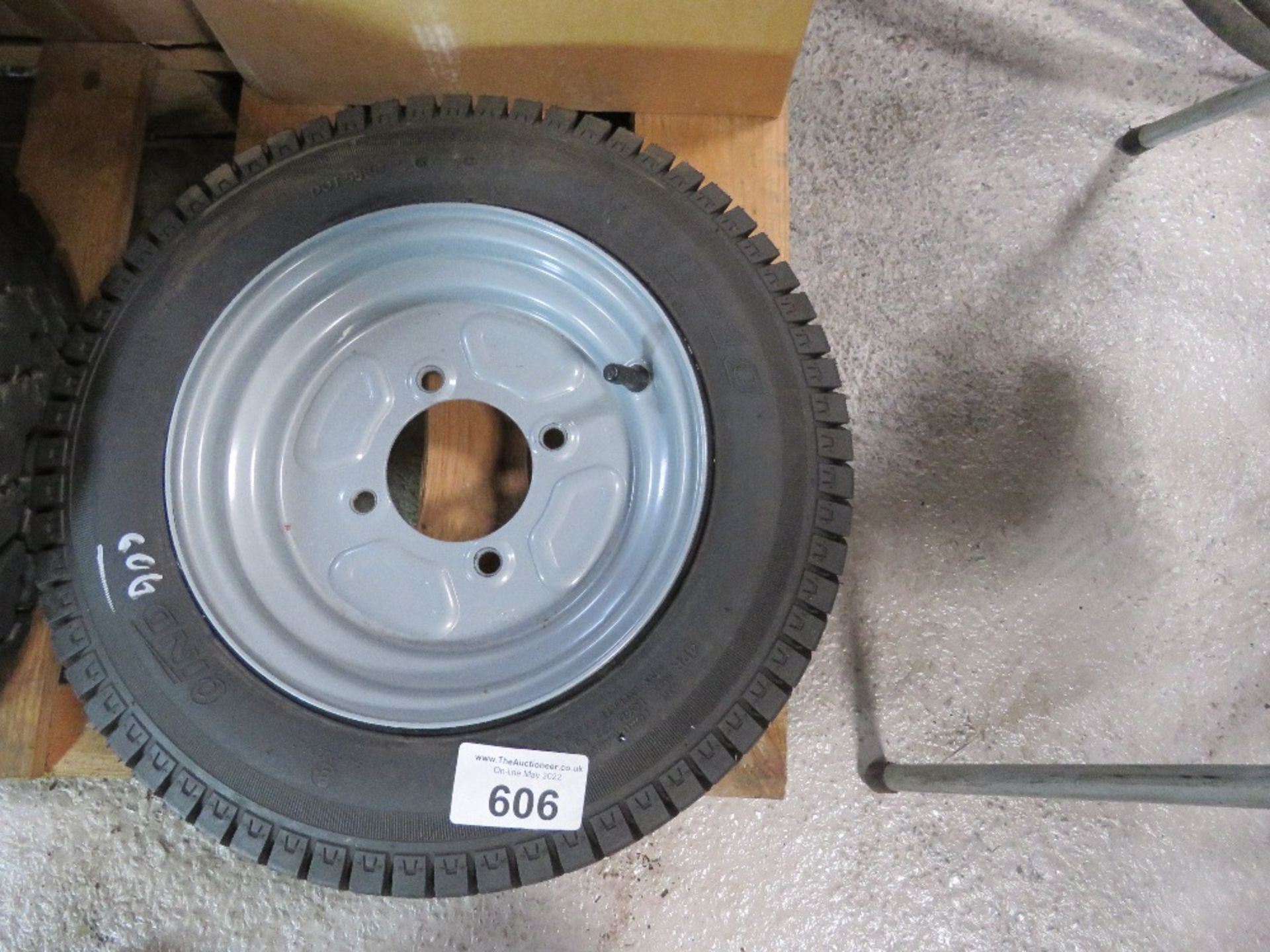 SMALL TRAILER WHEEL, 4 STUD RIM 4.00-10, UNUSED.