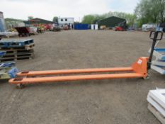 LONG BLADED BOARD PALLET TRUCK, 9FT LONG FORKS APPROX. WHEN TESTED WAS SEEN TO LIFT AND LOWER.
