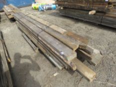 LARGE STACK OF HEAVY PRE USED MAINLY DENAILED TIMBERS, 9-13FT LENGTH APPROX, MAINLY 6" SIZE. THIS LO