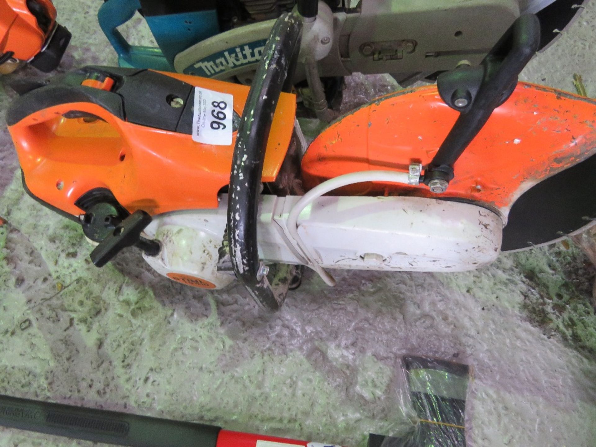 STIHL TS410 PETROL SAW WITH A BLADE.