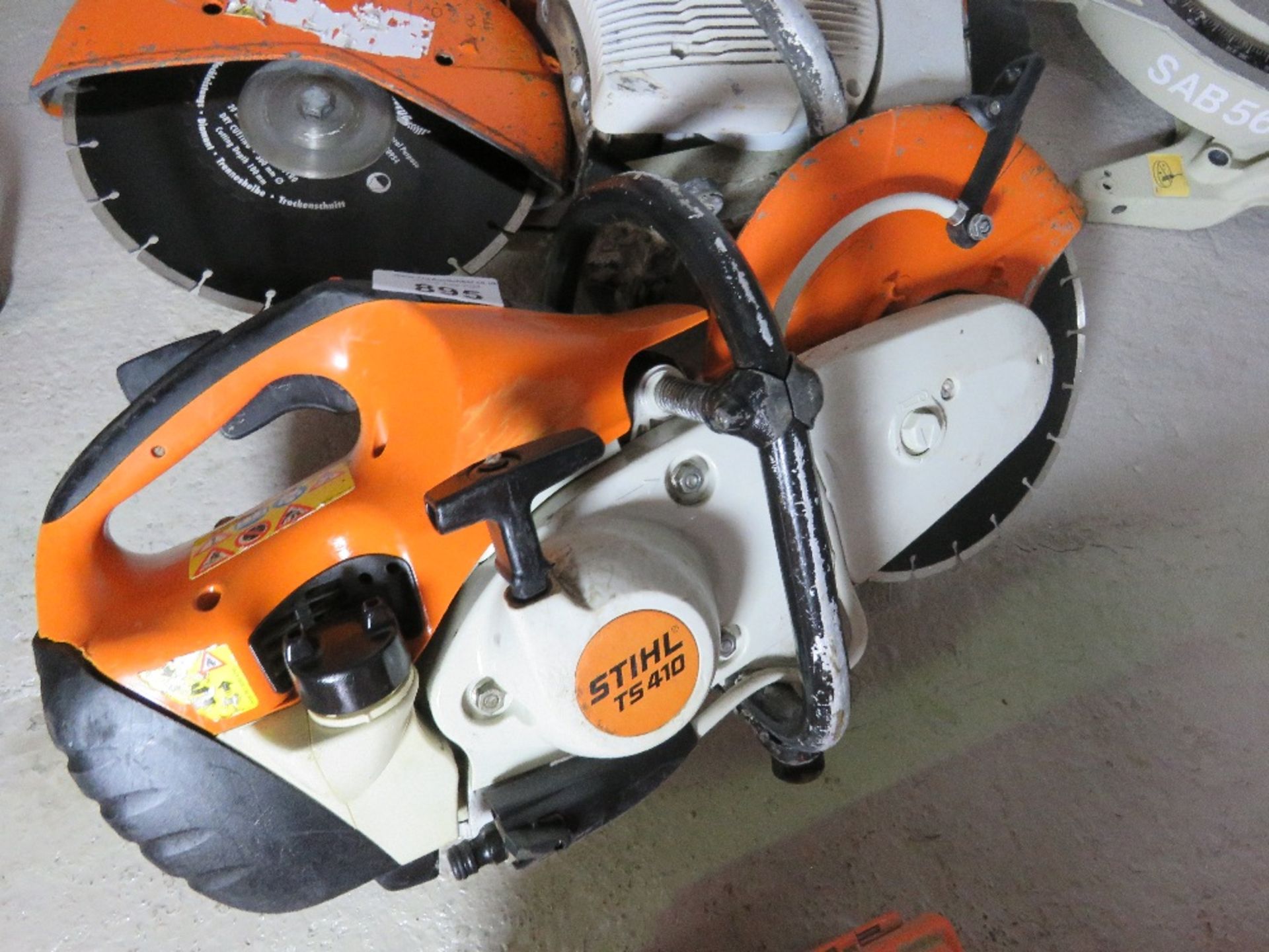 STIHL TS410 PETROL SAW WITH A BLADE.