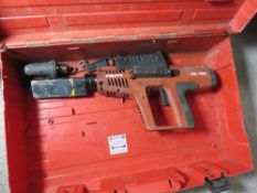 HILTI DX750 NAIL GUN IN A CASE.