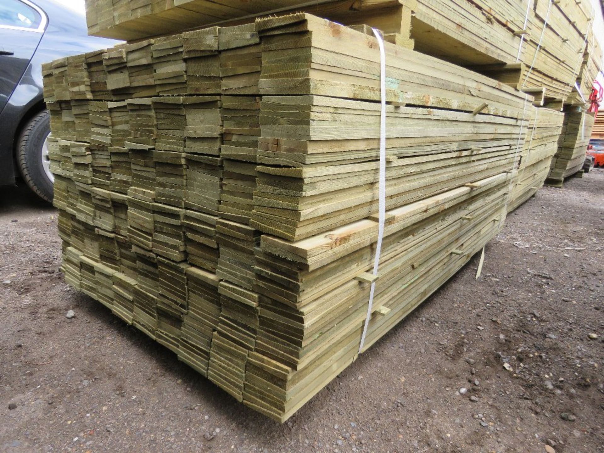LARGE PACK OF PRESSURE TREATED FEATHER EDGE FENCE CLADDING TIMBERS. 1.80M LENGTH X 10CM WIDTH APPROX