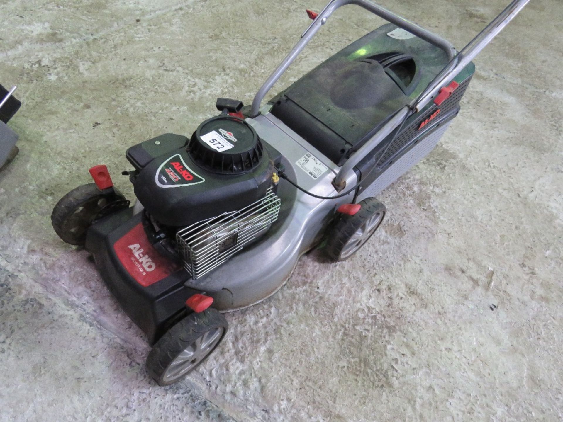 ALKO MOWER WITH A BOX. THIS LOT IS SOLD UNDER THE AUCTIONEERS MARGIN SCHEME, THEREFORE NO VAT WILL B