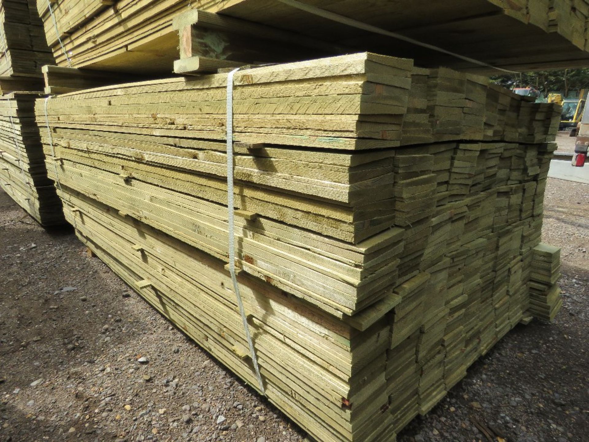 LARGE PACK OF PRESSURE TREATED FEATHER EDGE FENCE CLADDING TIMBERS. 1.80M LENGTH X 10CM WIDTH APPROX