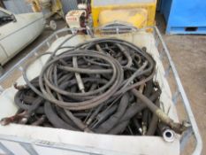 LARGE STILLAGE OF HYDRAULIC HOSES.