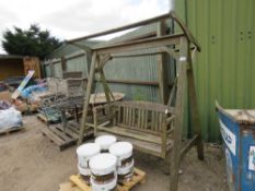 WOODEN SWING SEAT. THIS LOT IS SOLD UNDER THE AUCTIONEERS MARGIN SCHEME, THEREFORE NO VAT WILL BE CH