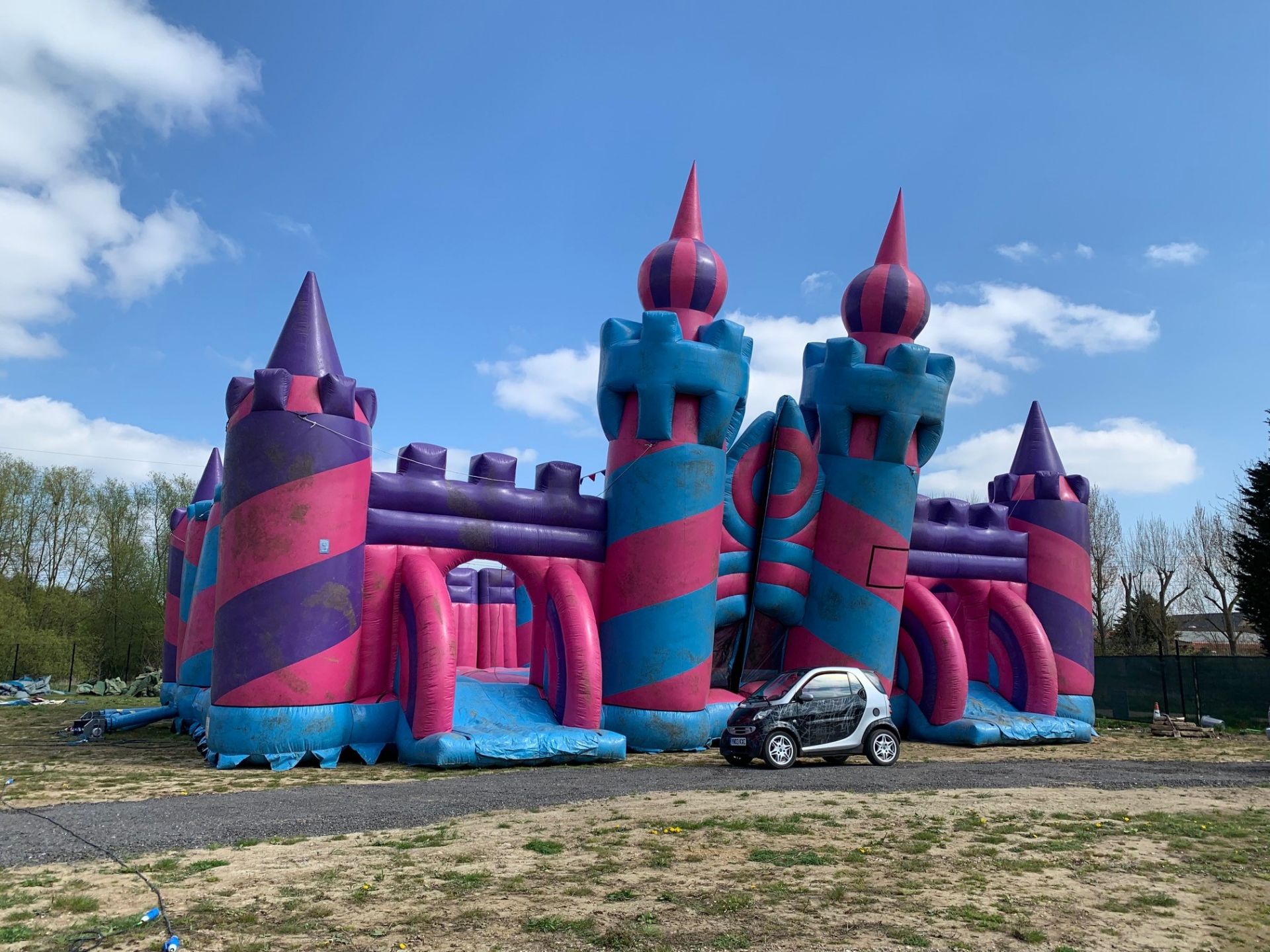 COLOSSAL INFLATABLE CASTLE. 24M X 21M APPROX SIZE. WHEN BUILT BELIEVED TO HAVE BEEN THE LARGEST IN