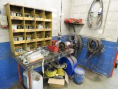 BENCH WITH GRINDER, LAYFLAT HOSES, AIR HOSES AND SUNDRY ITEMS, LOCATED IN SMALL WORKSHOP IN CORNER.