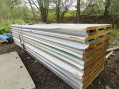 STACK OF INSULATED PROFILED CLADDING SHEETS 4.8M LENGTH X 1M WIDE @ 100MM DEPTH APPROX. THIS LOT IS