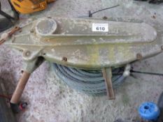 TIRFOR TYPE CABLE WINCH WITH A ROLL OF UNUSED CABLE AND A SHACKLE.