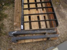 SET OF FORKLIFT TINES WITH A LOAD GUARD. THIS LOT IS SOLD UNDER THE AUCTIONEERS MARGIN SCHEME, THERE