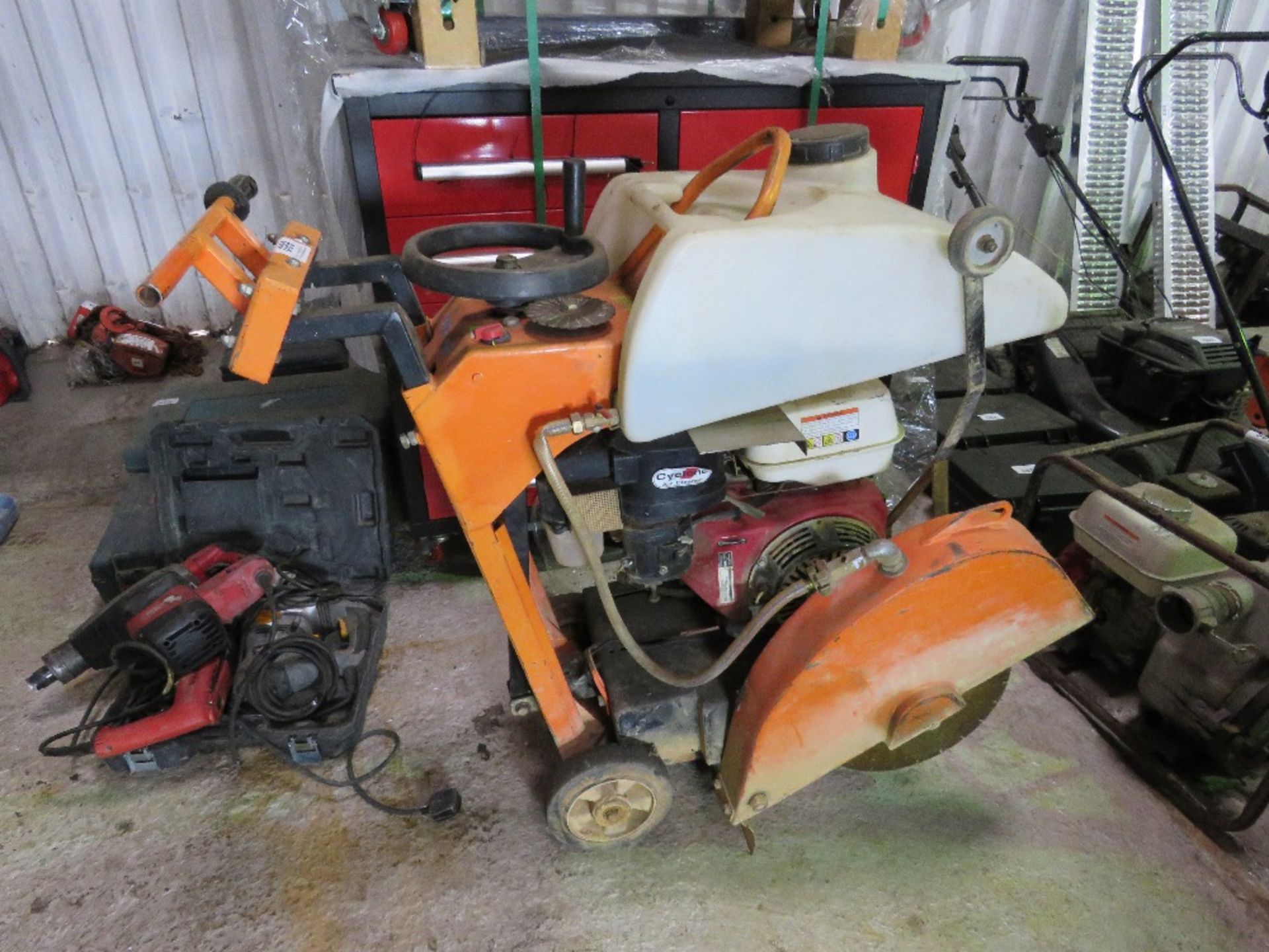 CLIPPER PETROL ENGINED FLOOR SAW WITH TANK AND BLADE. THIS LOT IS SOLD UNDER THE AUCTIONEERS MARGIN