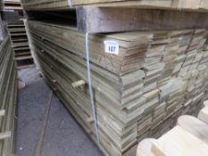 LARGE PACK OF TREATED FEATHER EDGE TIMBER CLADDING BOARDS. 1.80M LENGTH X 100MM WIDTH APPROX.
