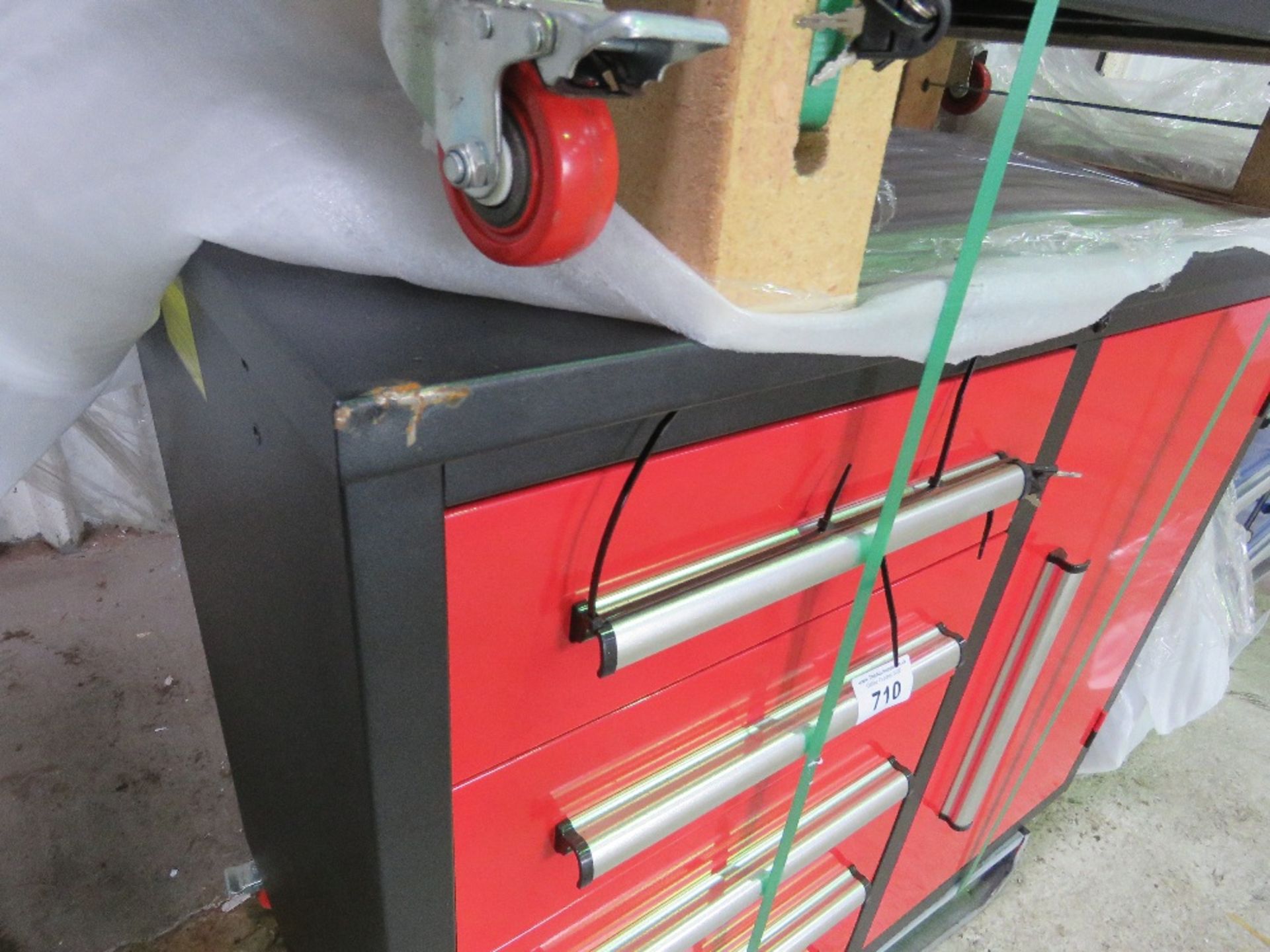 RED COLOURED WORKSHOP TOOL CABINET WITH WHEELS 1.12M WIDE X 0.65M DEPTH APPROX.