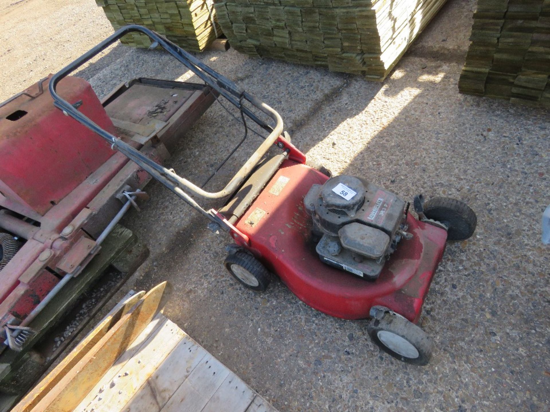 PETROL ENGINED MOWER.