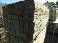 LARGE PACK OF FEATHER EDGE TREATED TIMBER FENCE BOARDS: 1.8M LENGTH X 100MM WIDTH APPROX.