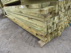 LARGE PACK OF APPROXIMATELY 204NO TREATED TIMBER BATTENS, 2.4-2.7M LENGTH APPROX, 55MMX45MM APPROX.