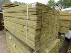 LARGE PACK OF TREATED FEATHER EDGE TIMBER CLADDING BOARDS. 1.65M LENGTH X 100MM WIDTH APPROX.