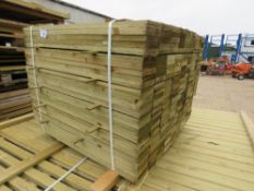 PACK OF TREATED FEATHER EDGE TIMBER CLADDING BOARDS. 0.9M LENGTH X 100MM WIDTH APPROX.