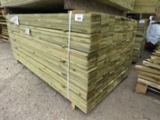 LARGE PACK OF TREATED FEATHER EDGE TIMBER CLADDING BOARDS. 1.65M LENGTH X 100MM WIDTH APPROX.