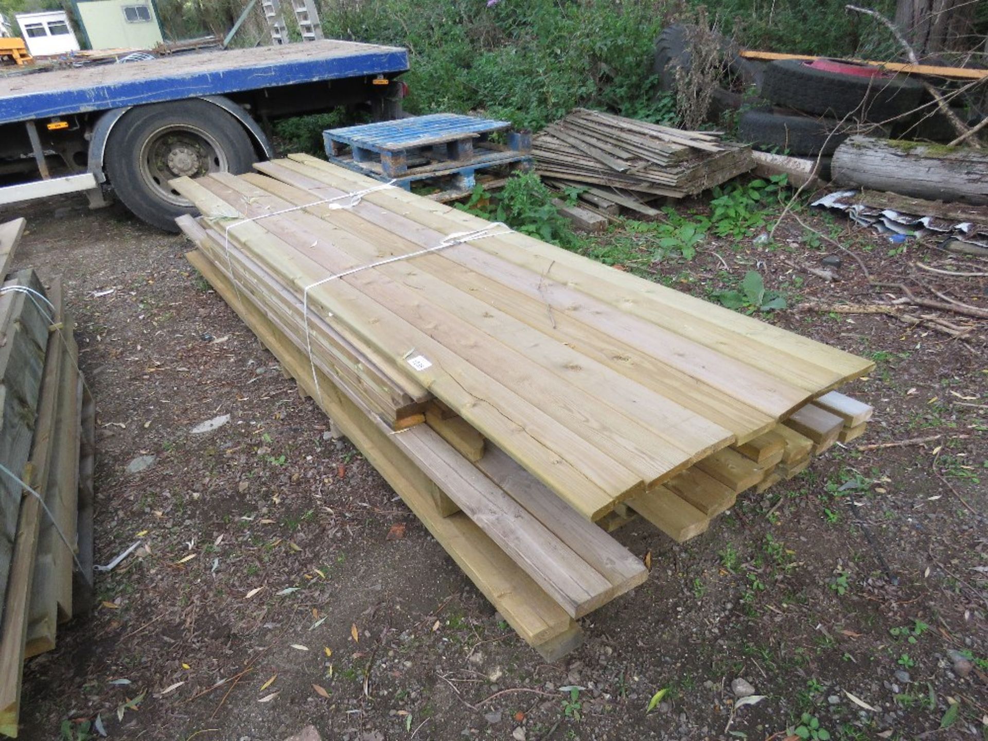 STACK OF ASSORTED FENCING TIMBERS.