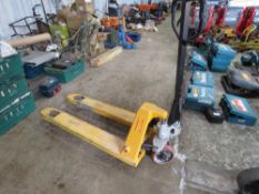 HYDRAULIC PALLET TRUCK, LIFTS AND LOWERS.