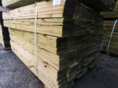 LARGE PACK OF PRESSURE TREATED FEATHER EDGE CLADDING TIMBER BOARDS. 1.35M X 100MM APPROX.