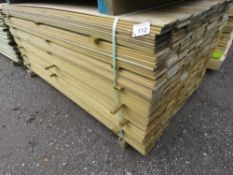 LARGE PACK OF TREATED HIT AND MISS TIMBER CLADDING BOARDS. 1.75M LENGTH X 95MM WIDTH APPROX.