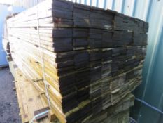 LARGE PACK OF PRESSURE TREATED FEATHER EDGE CLADDING TIMBER BOARDS. 1.8M X 100MM APPROX.