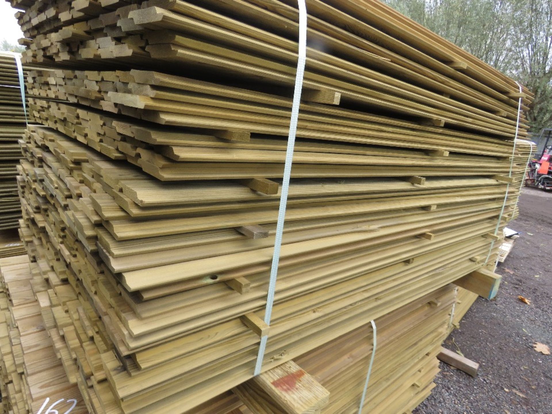 LARGE PACK OF TREATED SHIPLAP TIMBER CLADDING BOARDS. 1.73M LENGTH X 95MM WIDTH APPROX.