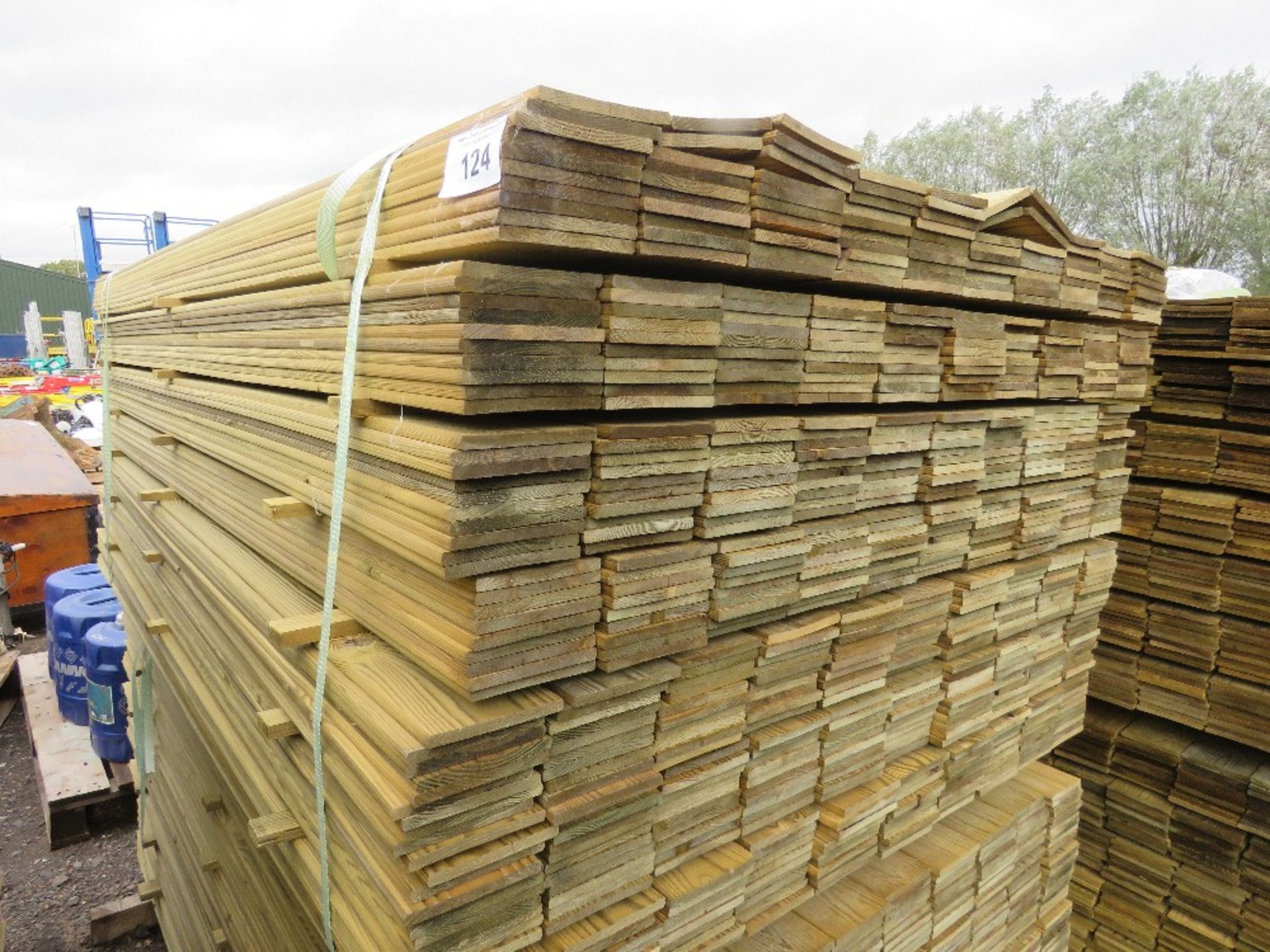 LARGE PACK OF TREATED HIT AND MISS TIMBER CLADDING BOARDS. 1.75M LENGTH X 95MM WIDTH APPROX.