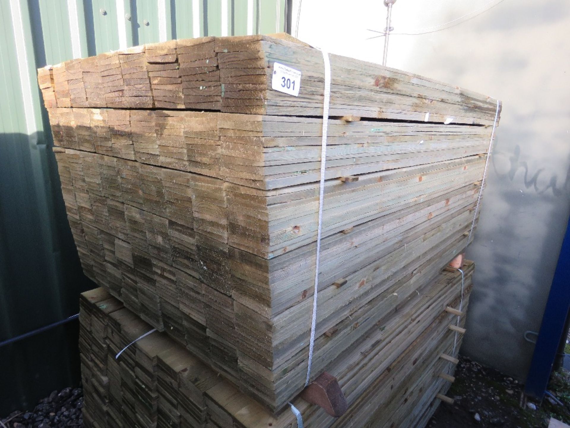 LARGE PACK OF PRESSURE TREATED FEATHER EDGE CLADDING TIMBER BOARDS. 1.5M X 100MM APPROX.