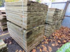 STACK OF TREATED FEATHER EDGE TIMBER: 2 X LARGE PACKS @ 1.5M LENGTH 100MM WIDTH APPROX.
