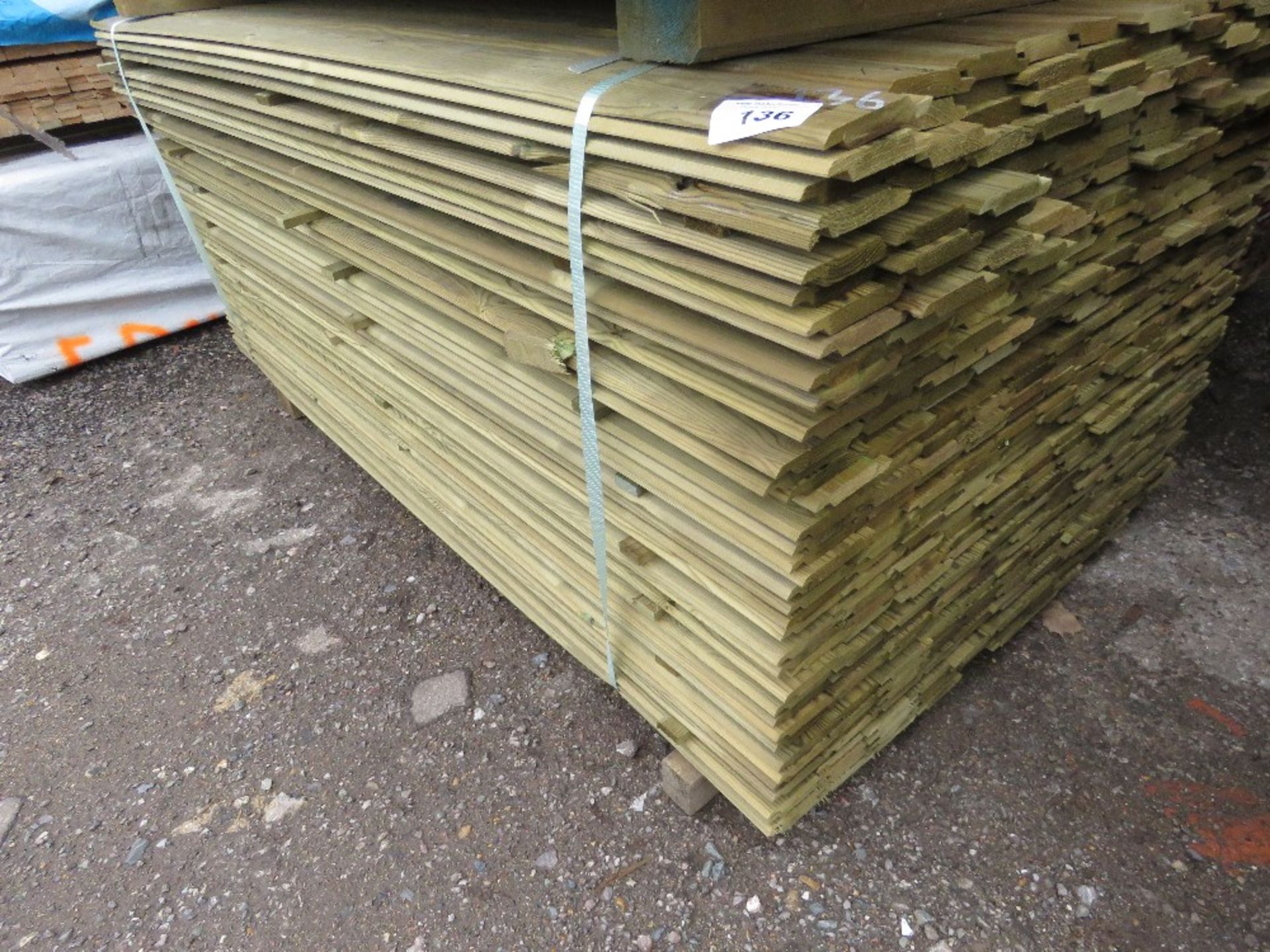 LARGE PACK OF TREATED SHIPLAP TIMBER CLADDING BOARDS. 1.73M LENGTH X 95MM WIDTH APPROX.